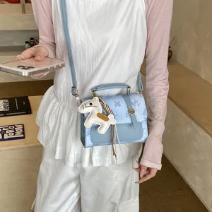 Fashion light blue crossbody bag for women, trendy mini shoulder handbag with cute horse charm.