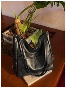 Black vintage faux leather tote bag for women, casual large capacity shoulder handbag.