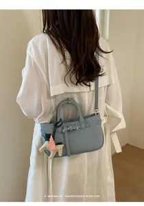 Retro lychee pattern leather shoulder bag for women with cute pegasus charm chic design.