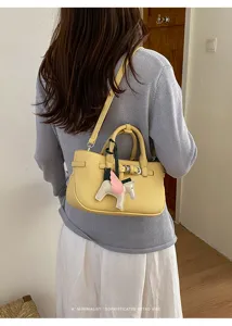 Women's yellow retro litchi pattern shoulder crossbody handbag with charm stylish bag.