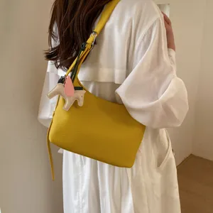 Yellow leather underarm shoulder bag for women minimalist casual commuter bag with cute charm