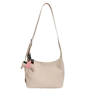 Minimalist beige underarm shoulder bag for women, stylish casual daily commuter handbag.
