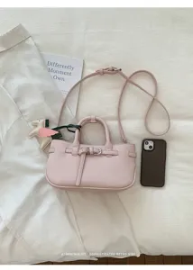 Pink litchi pattern leather handbag with retro belt buckle design and chic shoulder strap detail.
