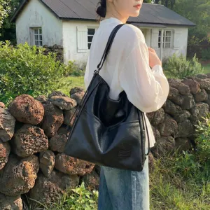Autumn vintage black leather tote bag for women, casual large capacity shoulder bag trend.