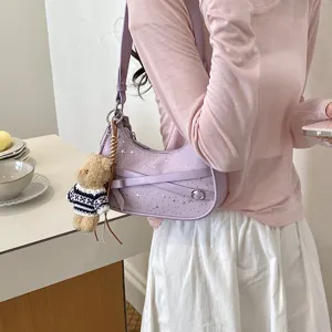 Chic purple shoulder bag for women with star studs and cute bear charm, trendy hobo handbag.