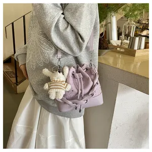 Korean style pleated bucket bag for women, stylish purple shoulder handbag with charm.