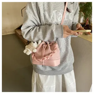 Pink pleated bucket bag detail, casual PU leather shoulder bag with bear pendant for women.