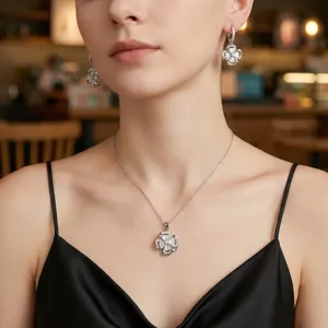 Elegant four-leaf clover pendant necklace and earrings set featuring sparkling zirconia.