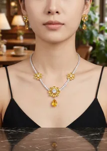 Detailed view of a luxury yellow gemstone floral necklace and matching sparkling earrings set.