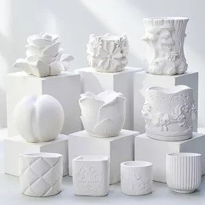 Detailed view of white embossed plaster aroma stones and silicone molds with various shapes.