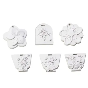 Handcrafted floral plaster diffuser stone hanging plaque set for DIY aromatherapy home decor.