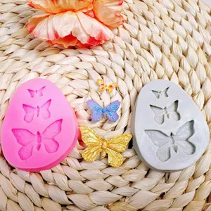Detailed view of 3d butterfly silicone mold showcasing intricate wing textures and finished crafts.