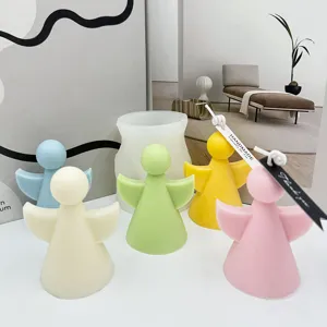 Silicone mold and handmade angel aromatherapy candles set, cute pastel colors for decor.