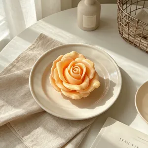 Exquisite 3D rose scented candle in elegant peach color on ceramic plate lifestyle photo