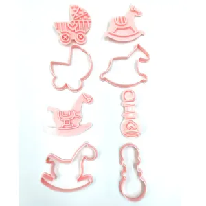 Pink plastic cookie cutters set featuring cute baby stroller and rocking horse fondant molds.