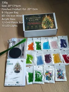 Complete DIY beaded Christmas tree kit including colorful beads, wire, and LED lights