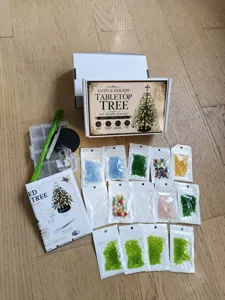 Complete components of DIY beaded Christmas tree craft kit with colorful beads