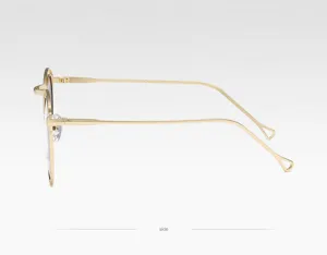 Lunettes de soleil élégantes à monture en métal doré pour hommes et femmes, profil latéral.