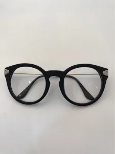 Detailed view of vintage retro round optical glasses frame with stylish metal accents.