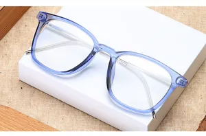 Close-up detail of stylish transparent blue half-metal vintage optical glasses frame.