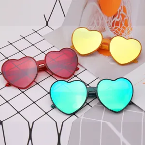 Trendy colorful heart-shaped sunglasses with reflective lenses for fashion party wear.