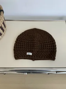 Brown hollow-out knitted beanie hat, retro winter warm slouchy cold cap for daily wear.