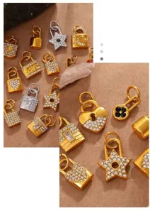 Close-up of gold and silver lock-shaped pendants with rhinestone pavé for jewelry making.