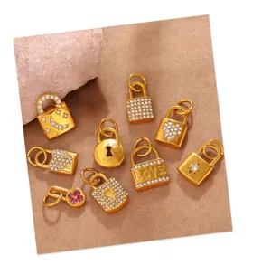 Detail view of retro gold-plated lock pendants with rhinestones and heart star patterns