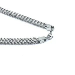 Close-up detail of stainless steel dragon chain clasp and link structure, durable quality.