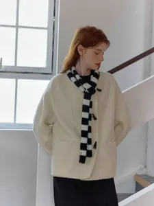 Chic black and white striped knitted scarf for women, stylish winter fashion accessory.