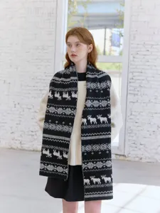 Detail view of Fair Isle elk jacquard knitted scarf, winter warm cozy winter neck accessory.