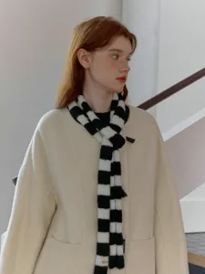 Black and white striped knit scarf detail, soft texture and cozy Y2K style wrap accessory.