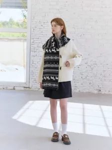 Nordic style deer jacquard knitted scarf detail showing cozy autumn winter fashion wear.
