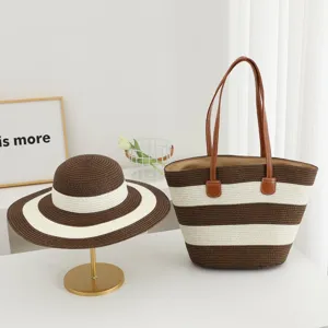 Summer straw beach shoulder bag and wide-brim sun hat set, stylish striped woven design.