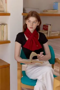 Cozy red knitted short scarf for women, featuring elegant floral embroidery and soft warmth.
