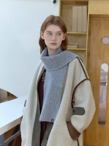 Cozy grey knit scarf for winter warmth, stylish ribbed neck warmer for daily wear.