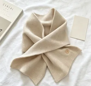 Chic beige knitted short scarf, elegant floral embroidery, cozy winter warm neck item.