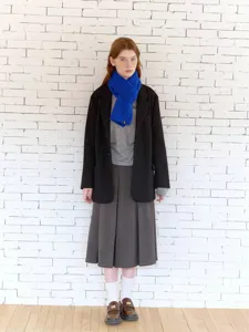 Detail view of the cozy blue cable-knit wool scarf, perfect for winter warmth and style.