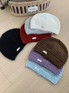 Detailed view of the Korean style retro hollow knit beanie, soft and breathable winter hat.