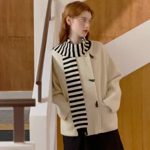 Stylish black and white striped knitted scarf and beige duffle coat winter fashion main view.