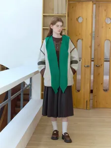 Detailed view of the stylish knit winter shawl and warm college style matching outfit.