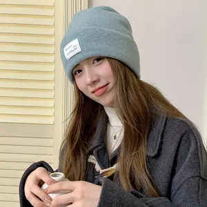 Cozy wool blend knitted beanie hat for women, winter warm thick roll-up skull cap style.
