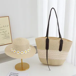 Stylish women straw hat and tote bag set, minimalist design with daisy decor for summer beach.