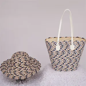 Detailed view of colorblock straw woven tote bag and matching sun hat set, spacious design.