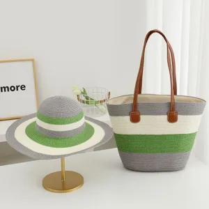 Detail view of summer straw beach hat and striped large capacity shoulder tote bag set.