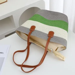 Striped straw shoulder bag for women, large capacity beach tote for summer vacation and travel.