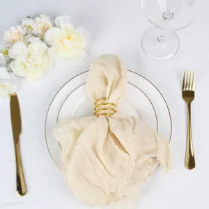 Bohemian gauze napkin with gold spiral ring for wedding party home table decor setup.