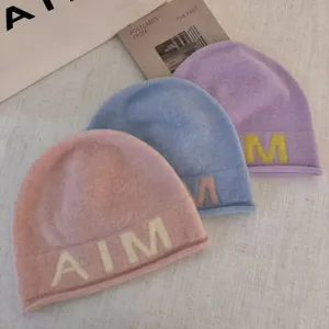 Cozy wool-blend knit beanie hat with letter embroidery for women, warm winter fashion casual cap.