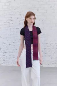 Knit scarf with polka dot and stripe pattern, soft, warm, versatile, cozy winter accessory.