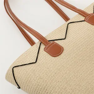 Strohgewebe Handtasche Detail, schicke Strandtasche mit PU Leder Griff und Kontrastdekor.